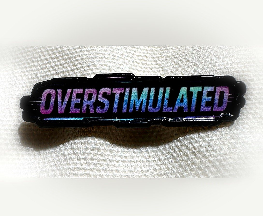 Overstimulated enamel pin